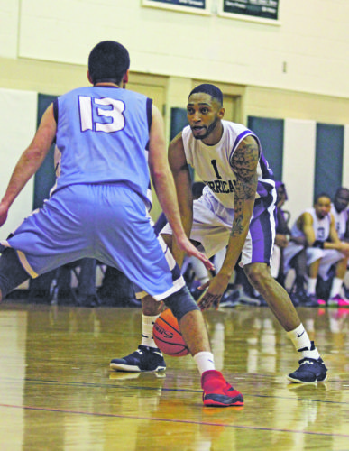 OBSERVER Photo by Mary Ann Wiberg Chautauqua Hurricane's Tyquan Stroman looks to make his move around Dubois Dream's Corey Callejas, during their Premier Basketball League matchup Saturday night at Brocton High School.